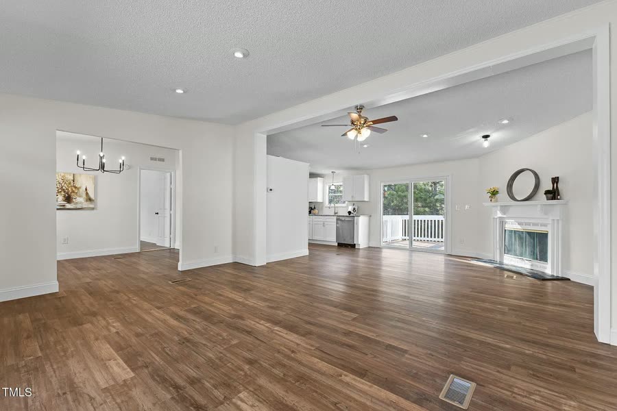 Open living area with new flooring after a full-home renovation